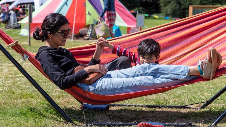 Mother & son relaxing in hammocks